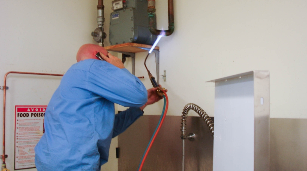 plumber brazing copper tube